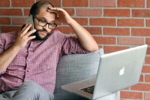person looking confused using a computer